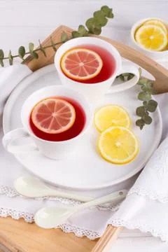 Two cups of red fruit and herbal tea with lemon slice, top view Foto stock