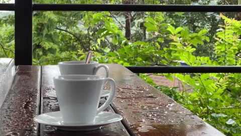 Two cups stand on the edge of the bathroom on the summer terrace Stock Footage 252025445