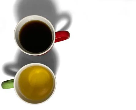 Two cups stand side by side, with their handles turned in opposite directions Stock Photos