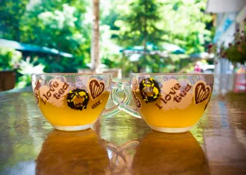 Two cups on a stone table Stock Photos