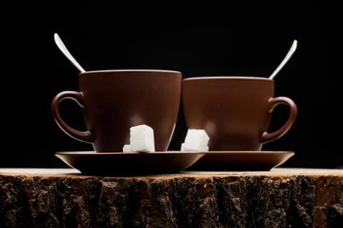 Two cups on a stump Stock Photos