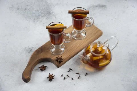 Two cups with tea and cinnamon sticks Stock Photos