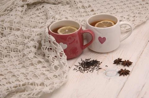 Two cups of tea and a scarf Stock Photos