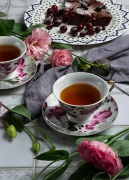 Two cups of tea on a beige kitchen table Stock Photos