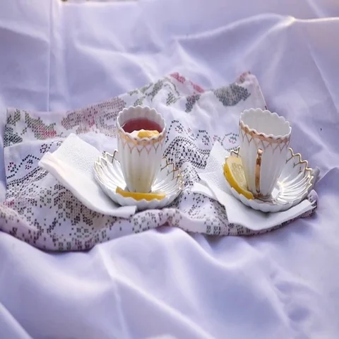 Two cups of tea with lemon at sunset . Stock Footage 69541194
