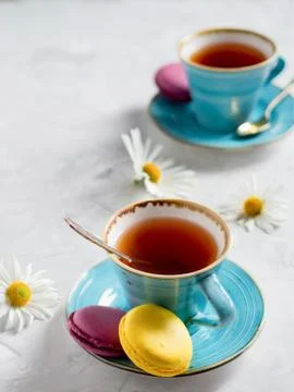 Two cups of tea with macaroons. Stock Photos