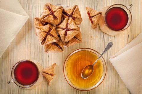 Two cups of tea, shortcake with jam and honey Stock Photos