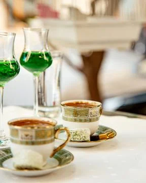 Two cups of turkish coffee served with sweets Stock Photos