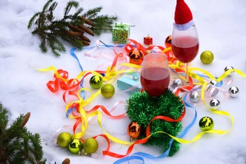 Two cups of warm beverage, sprigs of spruce and cedar cones . Winter still li Stock Photos