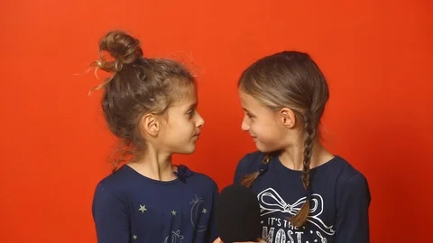Two Cute 7 Year Old Girls Singing Happy Birthday Song Into A Microphone Video stock 98828712