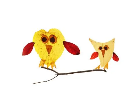 Two cute birds made of assorted Autumn leaves , isolated on white Stock Photos