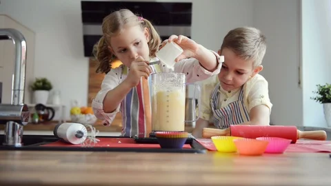Two cute children having fun during preparation christmas cookies Stock Footage 108062784