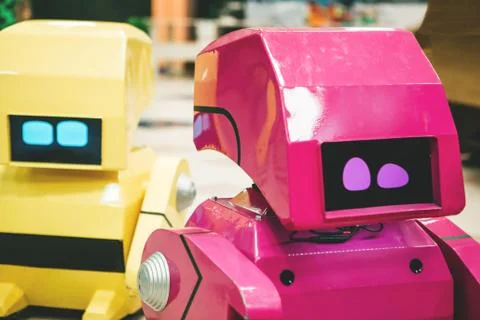 Two cute colored robots Stock Photos