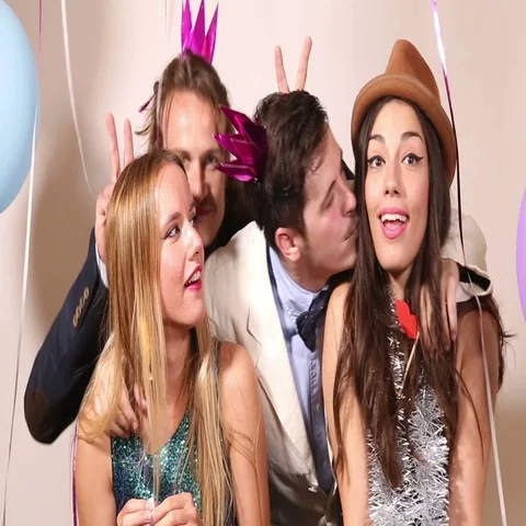 Two cute couples having fun in party pho... | Stock Video | Pond5