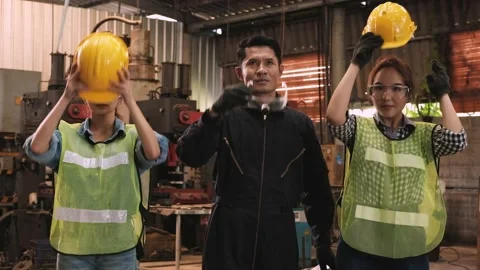 Two cute female engineers and senior engineer wear safety helmets and glasses Video stock 130191661