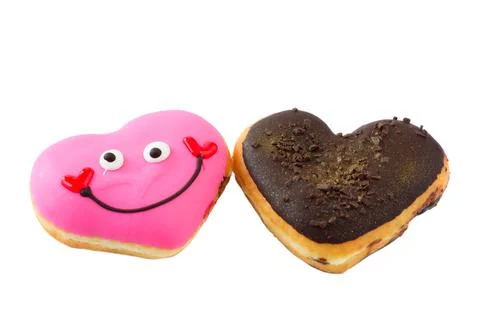 Two cute heart shape doughnuts isolated on white background Stock Photos