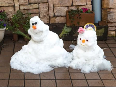 Two cute smiling snowman Foto stock