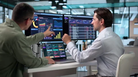 Two Cybersecurity Analysts Scan Laptop For Threats Stock Footage 347296316