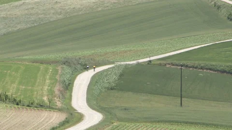 Two cyclists are training in the Piedmont countryside Stock Footage 59672916