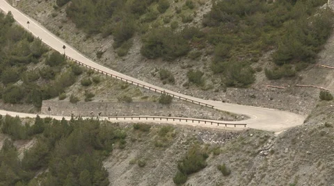 Two cyclists climb of the Stelvio Stock Footage 60184463