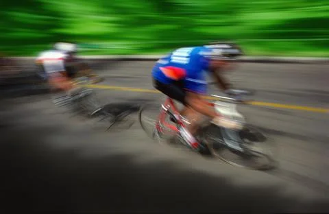 Two Cyclists Racing On Road Stock Photos