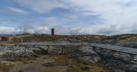 Two cyclists riding bicycle through bridge on a sunny day Stock Footage 85839294