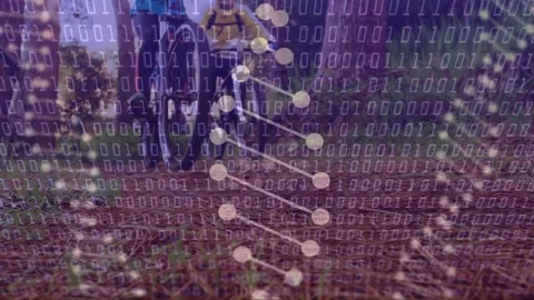 Two cyclists riding, camera closing, binary overlay expanding over front wheel Stock Footage 333817948