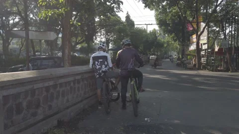 Two cyclists taking a break, Stock Footage 197620941