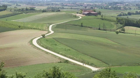 Two cyclists through the countryside of Monferrato Stock Footage 59679178