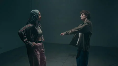 Two Dancers Entering Shot Facing each other in Studio Stock Footage 335680564