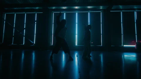 Two Dancers Practicing in Dark Studio Stock Footage 335681368