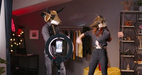Two dancers record trending reels for followers. In halloween masks unknown Video stock 245520380