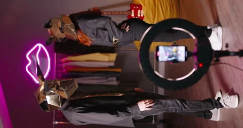 Two dancers record trending reels for followers. In halloween masks unknown Video stock 247246092