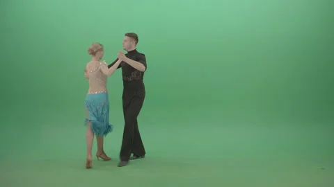 Two dancers spin along the green screen in fast waltz move Stock Footage 147920136
