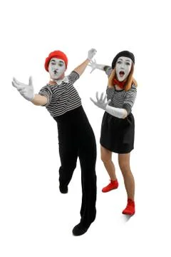 Two dancing mimes on white. Vertical studio shot of man and woman Stock Photos
