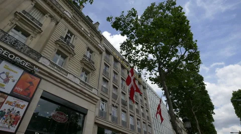 Two Danish flags on La Maison du Danemark, on Avenue des Champs-Elysees, Paris Stock Footage 57180201