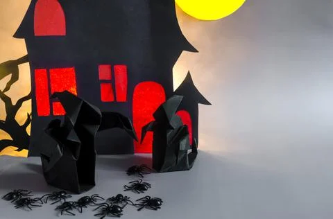 Two dark ghosts with black spiders on the background . Stock Photos