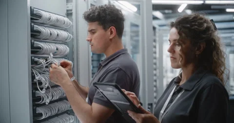 Two Data Center Engineers Performing Dual Control Network Maintenance Stock Footage 344971362