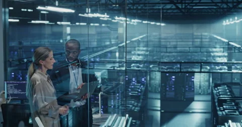 Two Data Center Engineers Using Laptop Computer Stock Footage 296173577