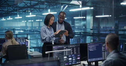 Two Data Center Engineers Using Tablet Computer Stock Footage 296174510