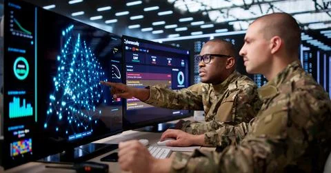 Two Data Scientists Analyze Military AI Models Using Advanced Software Tools. Stock Photos