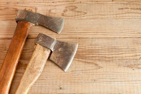 Two dated and used cleavers on wooden background Stock Photos