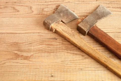 Two dated and used cleavers on wooden background Stock Photos