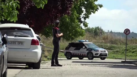 Two dead and five Mossos d'Esquadra officers injured when a man barricaded himse Stock Footage 312684400