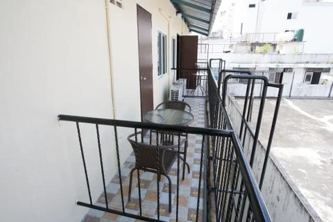 The two deck chairs and a small table in the balcony with a view Foto stock