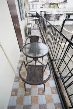 The two deck chairs and a small table in the balcony with a view Foto stock