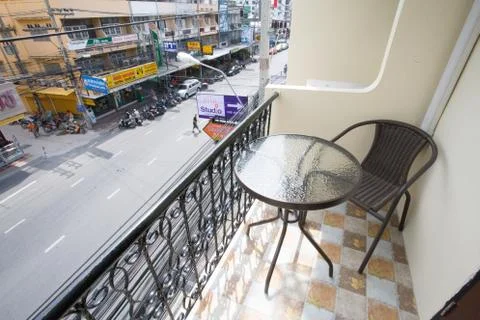 The two deck chairs and a small table in the balcony with a view Stock Photos