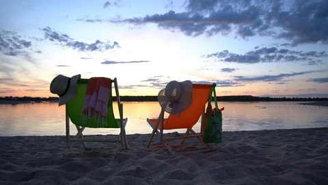 Two deckchairs at the beach Stock Footage 120678161