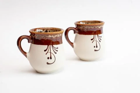 Two decorated clay mugs Stock Photos