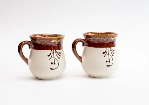 Two decorated clay mugs Stock Photos